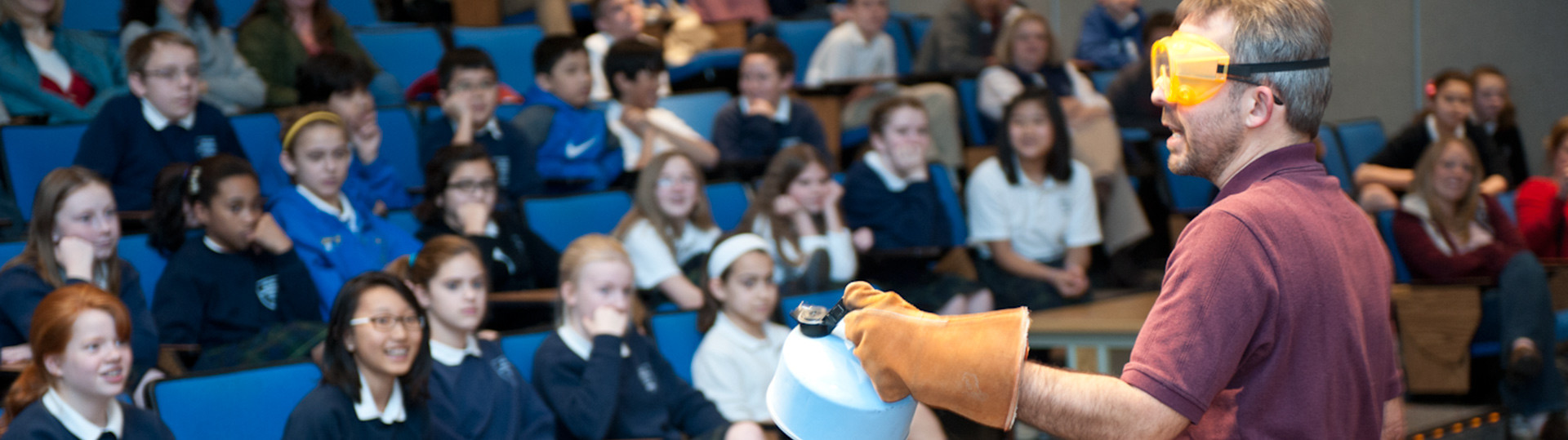 JLab Science Education staff member presents a liquid nitrogen demonstration to students.