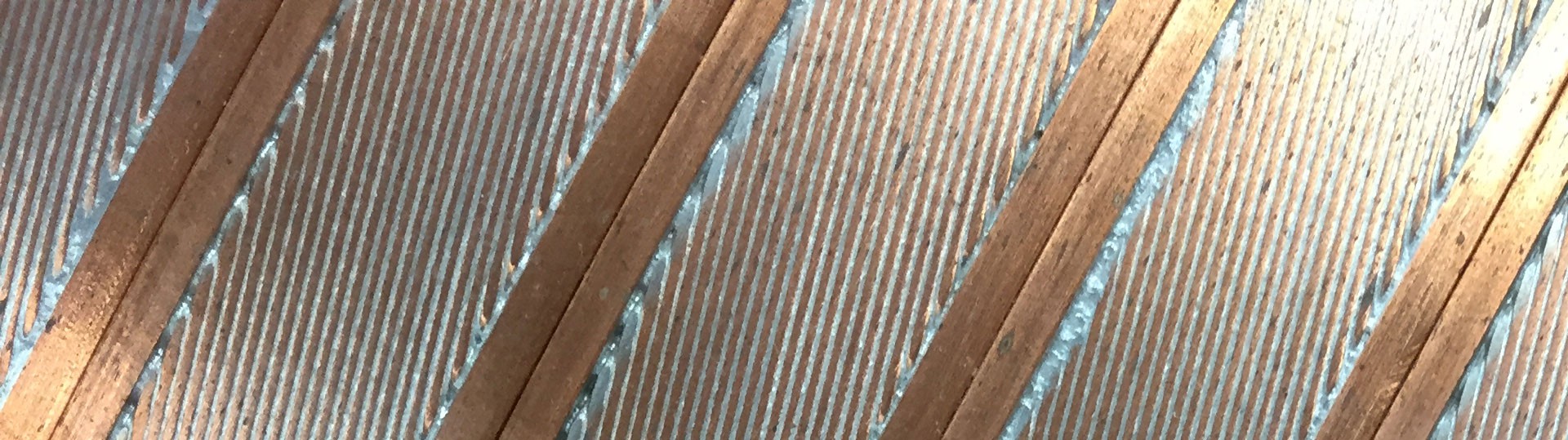 36-strand NbTi Rutherford cable soldered into a copper C-Channel. [Rutherford cable dimensions = 12 mm x 1.37 mm ; Conductor dimensions = 20 mm x 2 mm ; NbTi strand diameter = 0.648 mm ; Cu:Sc ratio (strand) = 1.8 ; No. of NbTi filaments/strand = 4600 ; Twist pitch = 15 mm ; Cable short sample limit = 11 kA @ 4.2 K and 5 T]