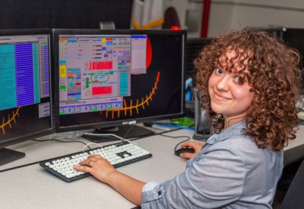 Kiarra Garcia at her workstation