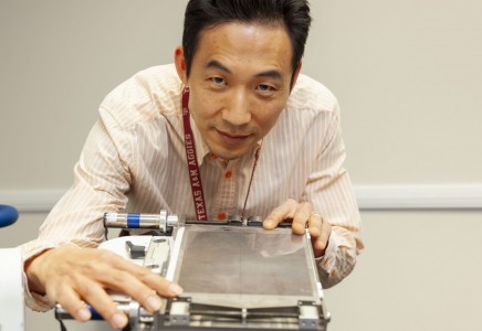 Seungjoon Lee is shown with the VASH collimator he developed.