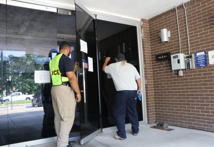 Todd Kujawa pretending to be an aggressor for the exercise at the front doors of the SSC