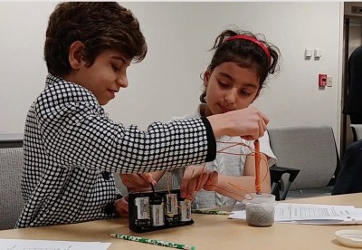 BEAMS students work together on a magnet activity