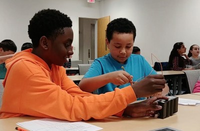 BEAMS students work together in pairs on a magnet activity