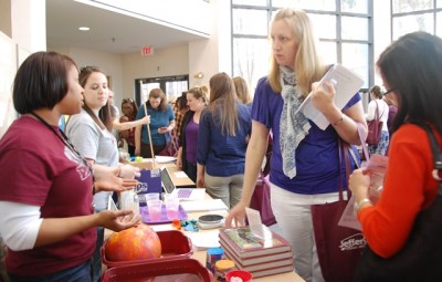 Teachers discuss an activity at Teacher Night 2018