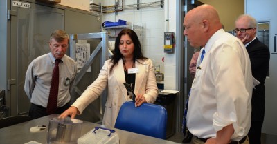 Christopher Fall learns about SRF accelerator cavities.
