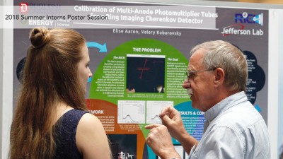 A student presents a poster during the 2018 Summer Intern Poster Session