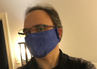 Theo McGuckin wears a homemade cloth face covering