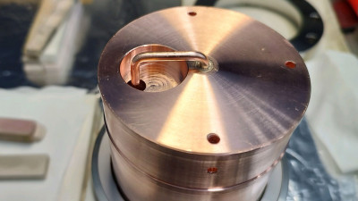 A remade chopper coupler - a copper cylinder attached to a stainless steel joint