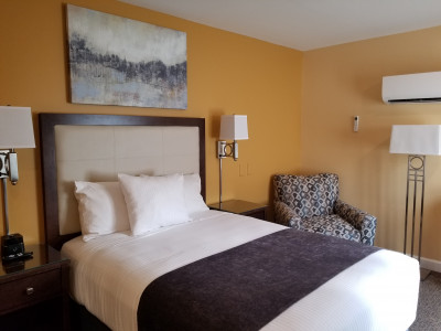 Modern design hotel room with new bed, chair