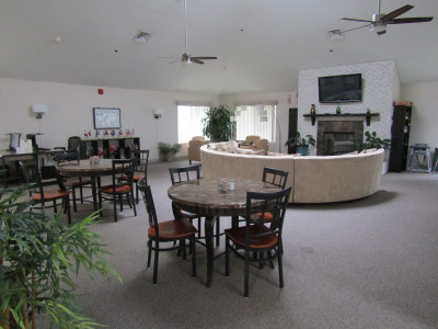Modern design great room with modern semi-circular couch, television