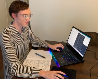 Elizabeth Moore working on a laptop