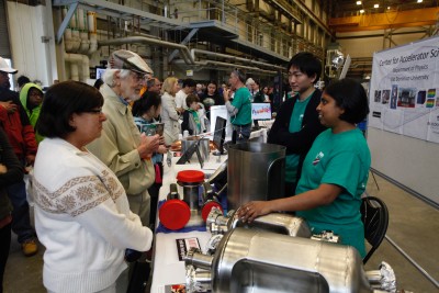 Jefferson Lab 2016 Open House image shows young researchers interacting with members of the public.