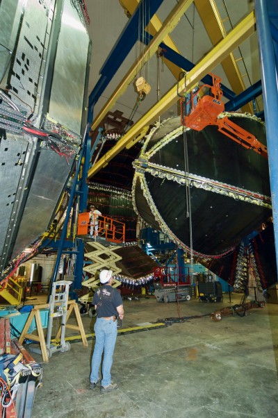 Worker in hard hat observes the detector in Hall B