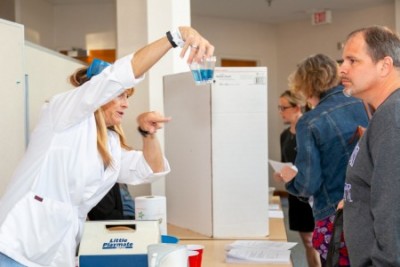 teacher with beaker