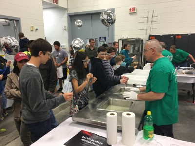 Jefferson Lab 2016 Open House image shows Jefferson Lab staff members interacting with the public.