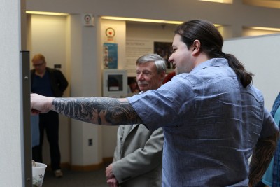 A principal investigator presents a poster on the results of his LDRD project