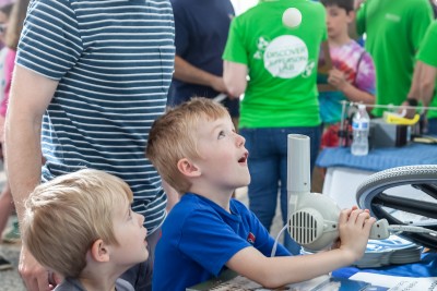 Members of the JLab community interact with the public at the Open House in 2018 - Local University exhibits