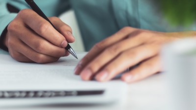 A researcher takes notes