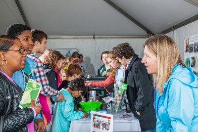 Jefferson Lab 2016 Open House image shows Jefferson Lab staff members interacting with the public.
